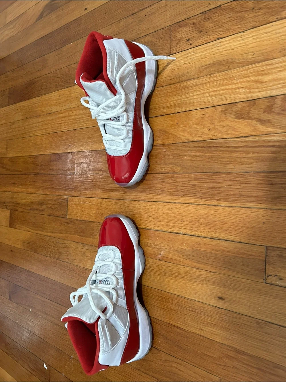Jordan 11 Retro Low Top Sneakers in Red and White